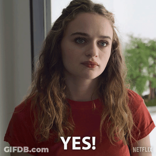 A Woman Wearing A Red T-Shirt Says Yes GIF