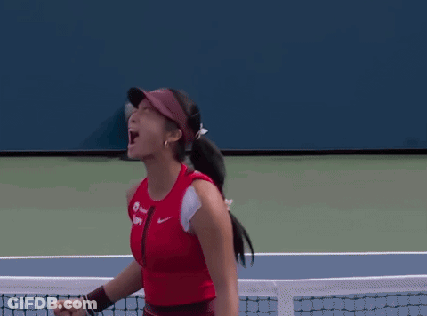 A Woman Wearing A Red Tank Top And A Visor With The Word Nike On It GIF