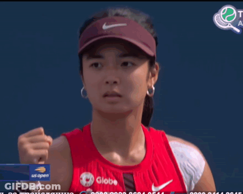 A Woman Wearing A Red Tank Top With Globe Written On It GIF