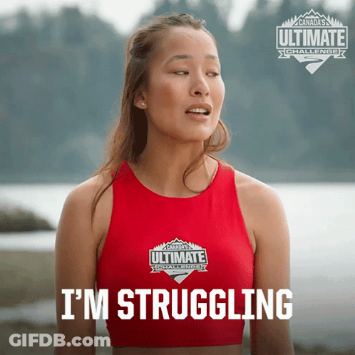 A Woman Wearing A Red Ultimate Challenge Tank Top GIF