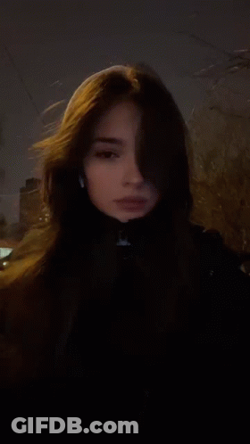 A Woman Wearing A Ring On Her Finger GIF