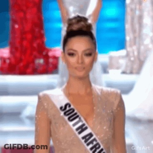 A Woman Wearing A Sash That Says South Africa On It GIF