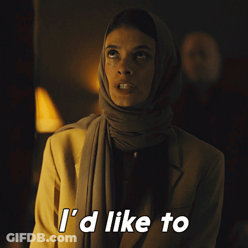 A Woman Wearing A Scarf And A Jacket Says " See You Try " GIF
