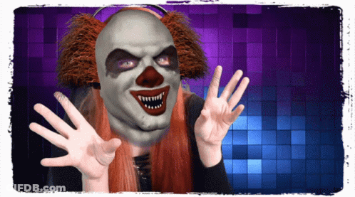 A Woman Wearing A Scary Clown Mask Is Making A Face GIF