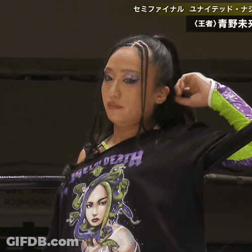 A Woman Wearing A Shirt That Says Angel Of Death GIF