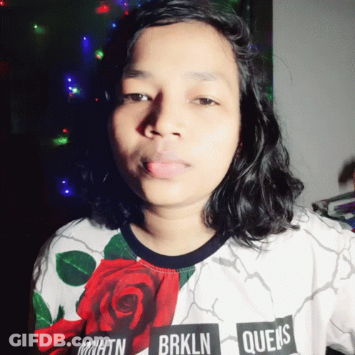 A Woman Wearing A Shirt That Says Brooklyn Queens GIF