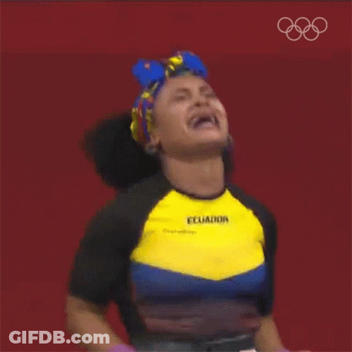 A Woman Wearing A Shirt That Says Ecuador Is Raising Her Arms In The Air GIF