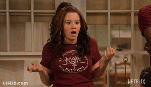 A Woman Wearing A Shirt That Says It Kelly Family Reunion Looks Surprised GIF