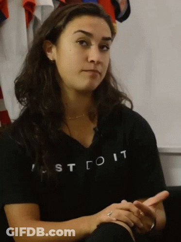 A Woman Wearing A Shirt That Says Just Do It On It GIF