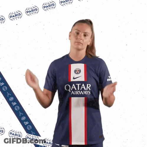 A Woman Wearing A Shirt That Says Qatar Airways Giving A Thumbs Up GIF