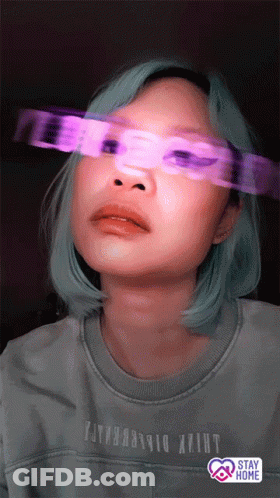 A Woman Wearing A Shirt That Says ' Stay Home ' On It GIF