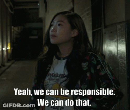 A Woman Wearing A Shirt That Says Yeah We Can Be Responsible GIF