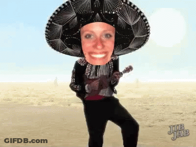 A Woman Wearing A Sombrero Is Playing A Guitar GIF
