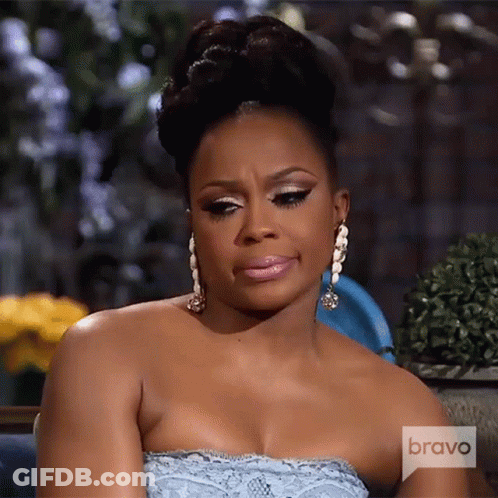 A Woman Wearing A Strapless Dress And Earrings Is On Bravo Television GIF