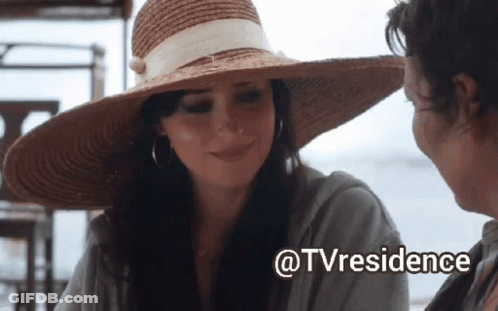 A Woman Wearing A Straw Hat Is Smiling Next To Another Woman With The Words @Tvresidence Written Below Her GIF
