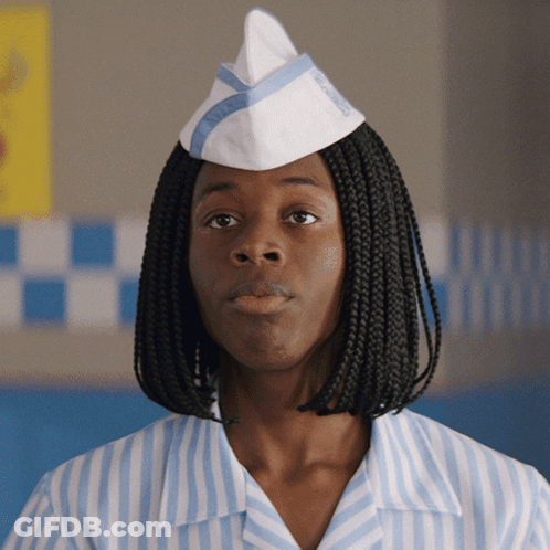 A Woman Wearing A Striped Shirt And A White Hat With The Word Wendy 'S On It GIF