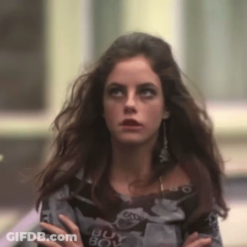 A Woman Wearing A Sweater That Says Buy Boy On It GIF