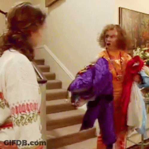 A Woman Wearing A Sweater That Says ' Christmas Sweater ' On It GIF