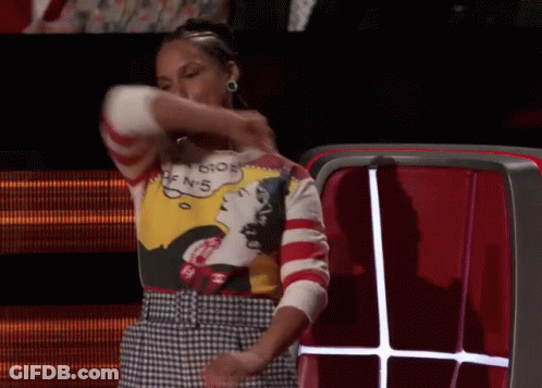 A Woman Wearing A Sweater That Says ' I 'M Sorry ' On It GIF