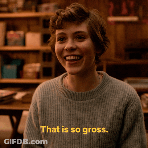 A Woman Wearing A Sweater That Says That Is So Gross On It GIF
