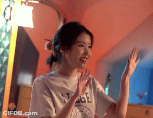 A Woman Wearing A T-Shirt That Says ' Age ' On It Is Smiling GIF