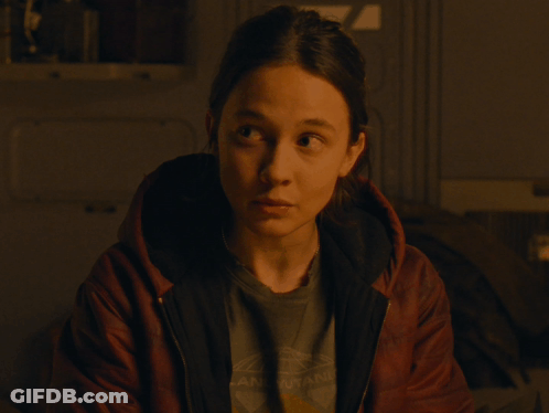 A Woman Wearing A T-Shirt That Says " Arkansas " On It GIF