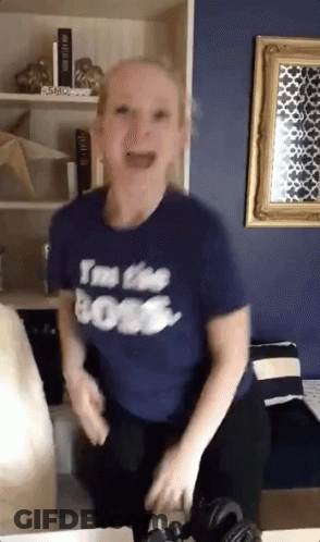 A Woman Wearing A T-Shirt That Says I 'M The Boss GIF