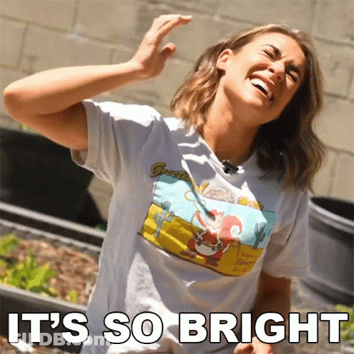A Woman Wearing A T-Shirt That Says ' It 'S So Bright ' GIF