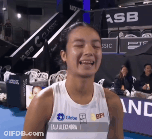 A Woman Wearing A Tank Top That Says Eala Alexandra GIF