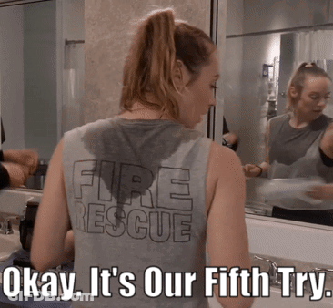A Woman Wearing A Tank Top That Says Fire Rescue On It GIF