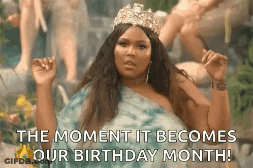 A Woman Wearing A Tiara And A Blue Dress Says The Moment It Becomes Our Birthday Month . GIF