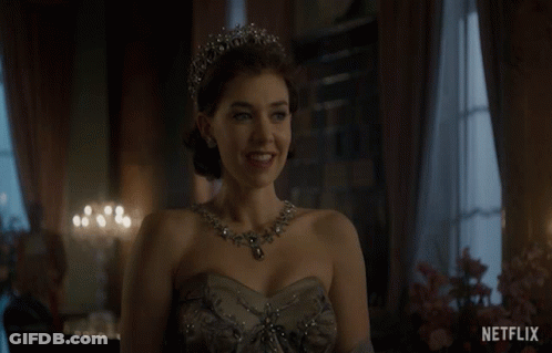 A Woman Wearing A Tiara And A Necklace With The Word Netflix On The Bottom Right GIF