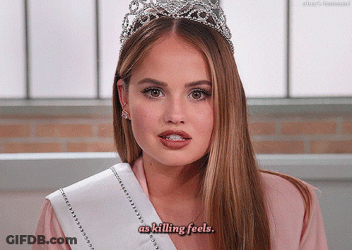 A Woman Wearing A Tiara And A Sash That Says As Killing Feels GIF