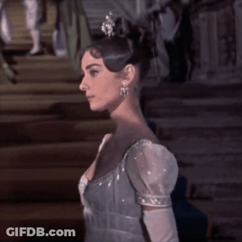 Woman In Tiara And Gloves On Stairs GIF
