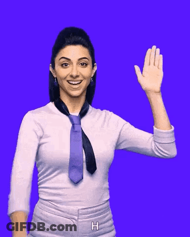 A Woman Wearing A Tie And A White Shirt Is Waving Her Hand GIF