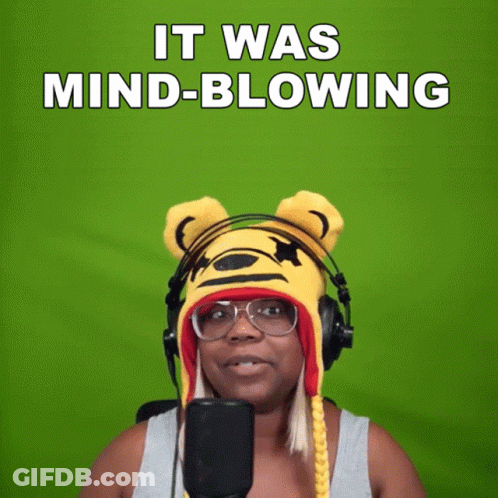 A Woman Wearing A Tiger Hat And Headphones Says " It Was Mind Blowing " GIF