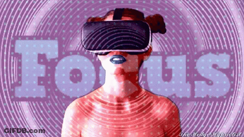 A Woman Wearing A Virtual Reality Headset With The Word Focus Written In The Background GIF