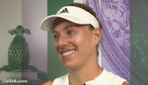 A Woman Wearing A White Adidas Hat Smiles GIF