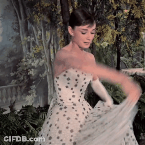 Woman In White Dress With Black Polka Dots GIF