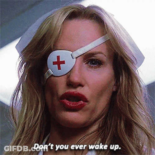 A Woman Wearing A White Eye Patch With A Red Cross On It Says Don 'T You Ever Wake Up GIF