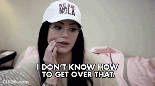 A Woman Wearing A White Hat That Says " We Are Nola " GIF