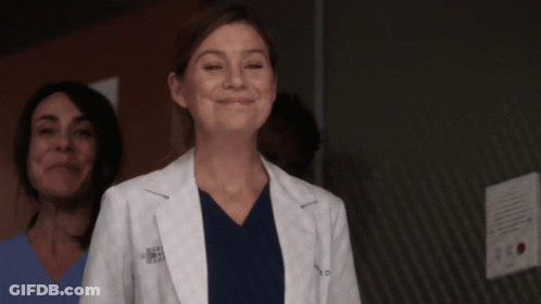 A Woman Wearing A White Lab Coat With The Letters A.p.m.s. On It GIF