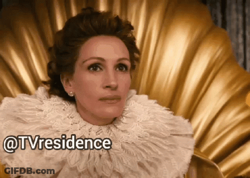 A Woman Wearing A White Lace Collar Is Sitting On A Gold Chair With The Words Tvresidence Written Below Her GIF