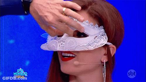 A Woman Wearing A White Mask With A Sbt Logo On The Bottom Right GIF