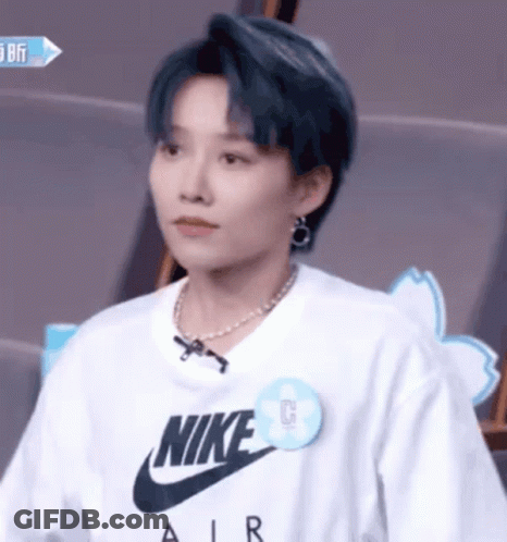 A Woman Wearing A White Nike Air T Shirt GIF