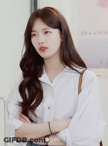 A Woman Wearing A White Shirt Has The Number 941010 On Her Sleeve GIF