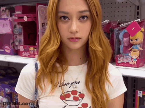 A Woman Wearing A White Shirt That Says I Love You GIF