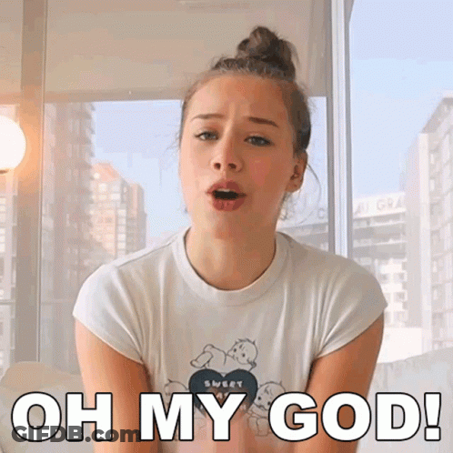 A Woman Wearing A White Shirt That Says Oh My God On It GIF