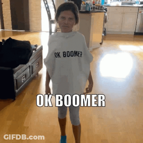 A Woman Wearing A White Shirt That Says Ok Boomer On It GIF