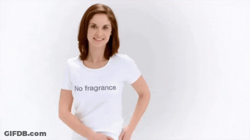 A Woman Wearing A White T-Shirt With The Words `` No Parabens '' On It Is Dancing . GIF